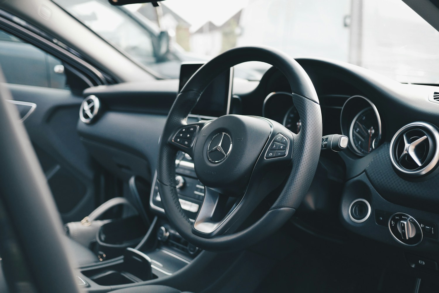 The steering wheel and interior of a right-hand-drive car